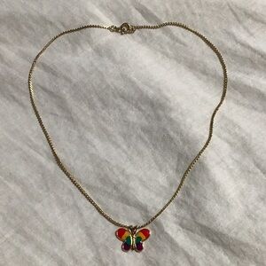 Children’s golden necklace with colorful butterfly pendant